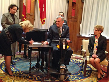 Madeleine Meilleur is sworn in as attorney general by Lieutenant Governor David Onley and Premier Kathleen Wynne.