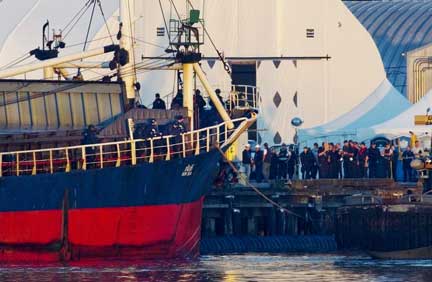 Canadian Border officials and police stand the deck of the MV Sun Sea after its arrival in B.C. in 2010. (Photo: Andy Clark/Reuters) 