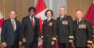 Deputy Minister of National Defence John Forster; Minister of National Defence Harjit Singh Sajjan; Judge Advocate General Geneviève Bernatchez; Major-General Blaise Cathcart, former judge advocate general; and General Jonathan Vance, chief of defence staff, stand together during the change of appointment ceremony for the JAG.